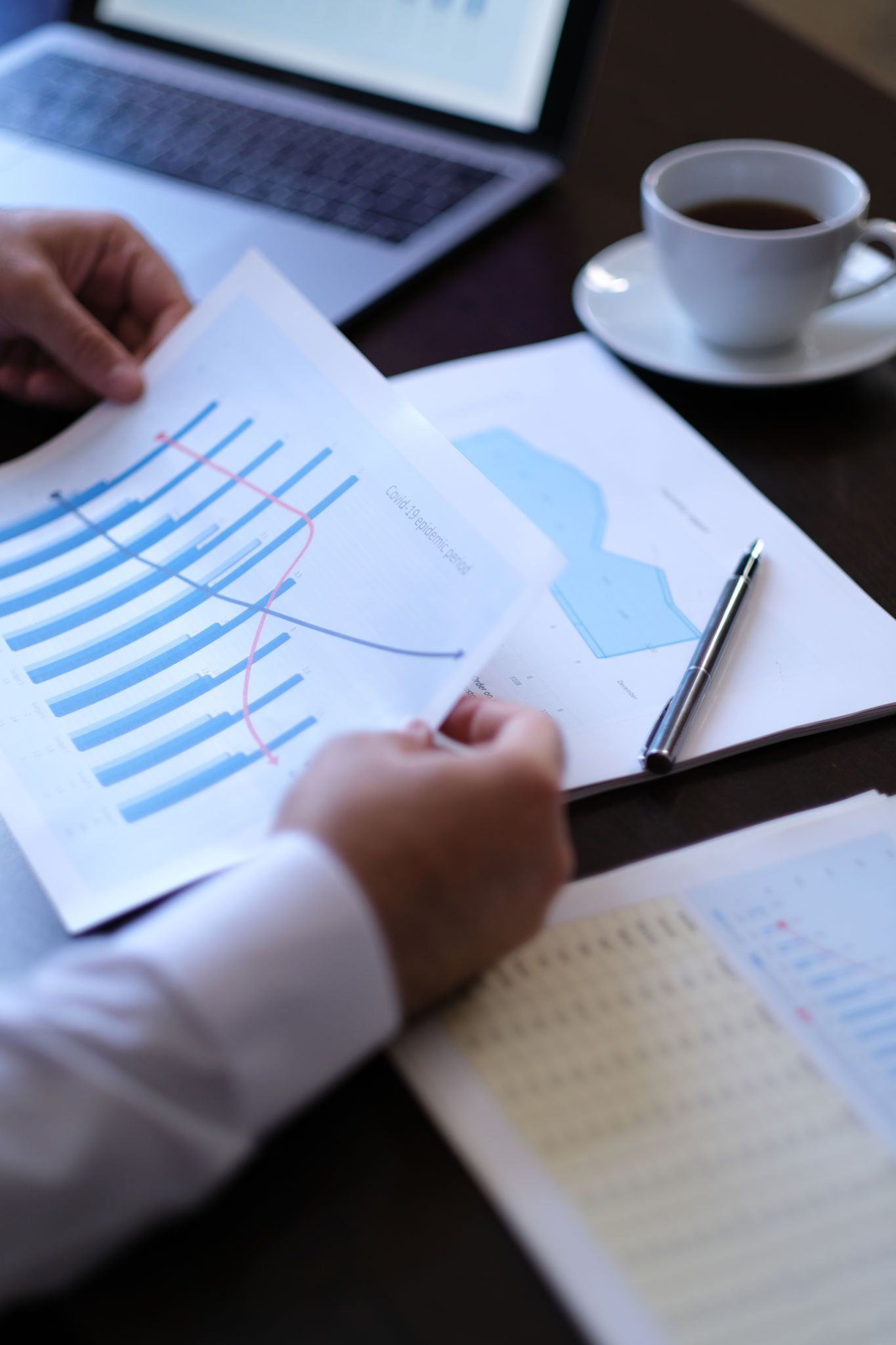Businessman analyzing pandemic period economic data Businessman analyzing pandemic period economic data
