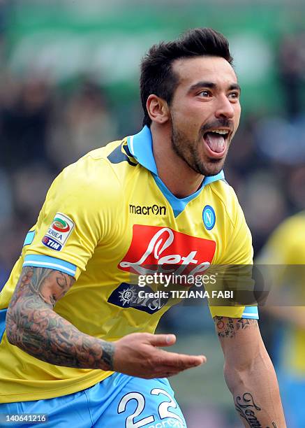 Napoli's Argentine forward Ezequiel Ivan Lavezzi celebrates after scoring against Parma during Italian Serie A football match on March 4, 2012 at...