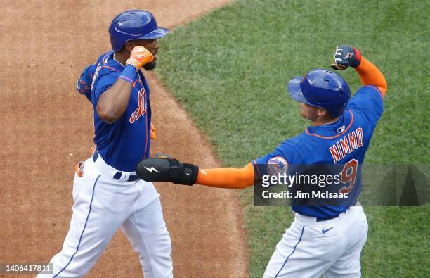 Starling Marte of the New York Mets celebrates his first inning two run home run against the Texas Rangers with teammate Brandon Nimmo at Citi Field...