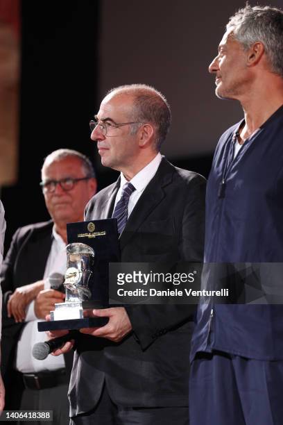 Carlo Siliotto, Giuseppe Tornatore, with the "Taormina Arte Award" and Rosario Fiorello are seen on stage during the Taormina Film Fest 2022 on July...