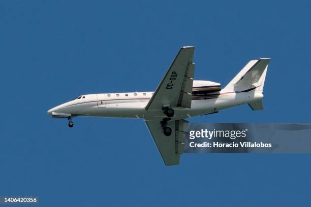 JetNetherlands Cessna 680 Citation Sovereign flies over the Tagus River on her way to land at Humberto Delgado International Airport on July 02, 2022...