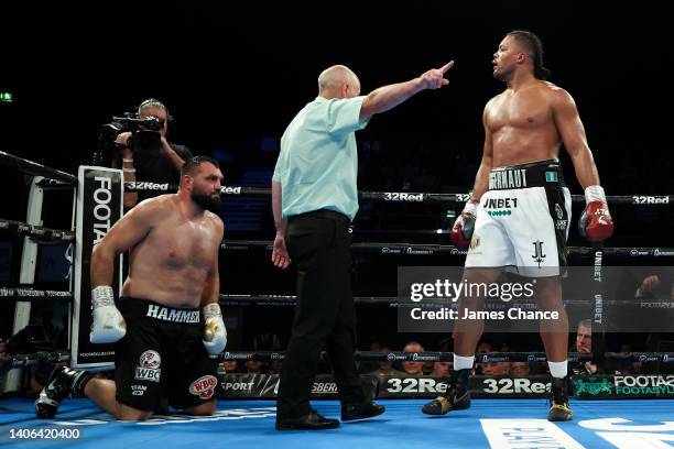 Joe Joyce reacts after knocking down Christian Hammer during the WBC Silver Silver and WBO International Heavyweight Title fight between Joe Joyce...