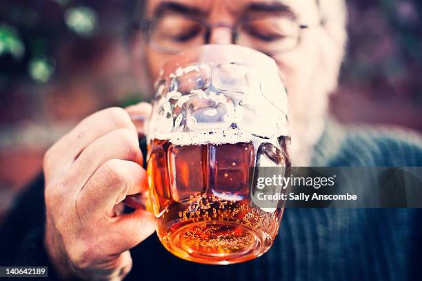 man drinking pint of beer - altbier stock-fotos und bilder