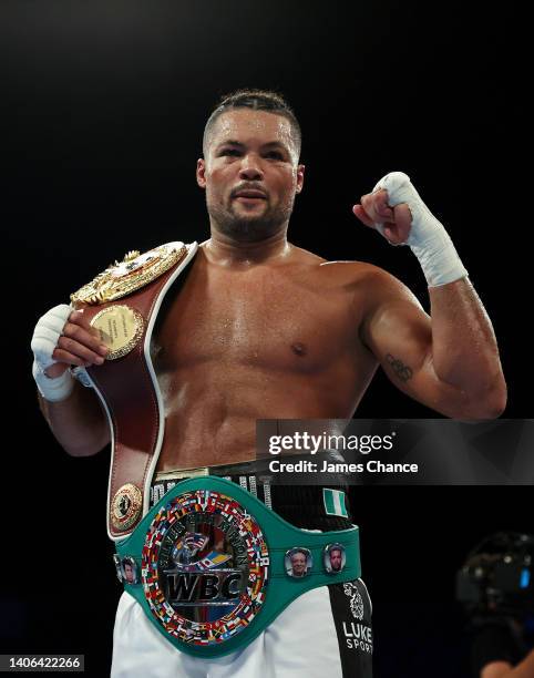 Joe Joyce celebrates with the WBO International Heavyweight belt after defeating Christian Hammer in the WBC Silver Silver and WBO International...