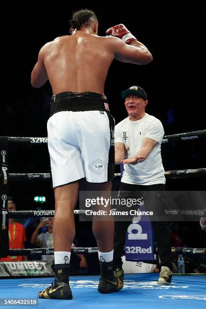 Joe Joyce celebrates with trainer Ismael Salas after defeating Christian Hammer during the WBC Silver Silver and WBO International Heavyweight Title...