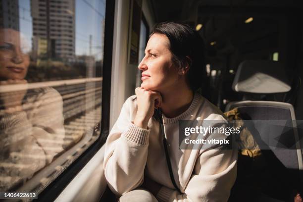woman inside a train - transporte público imagens e fotografias de stock