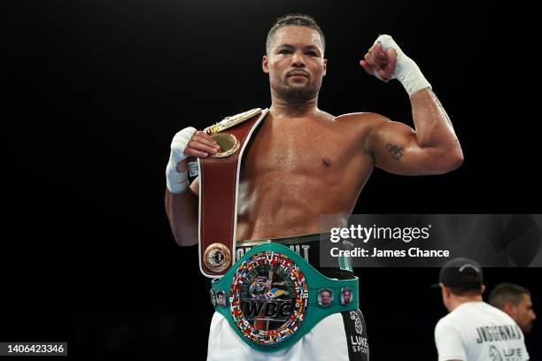 Joe Joyce celebrates with the WBO International Heavyweight belt after defeating Christian Hammer in the WBC Silver Silver and WBO International...