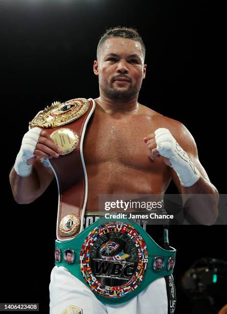 Joe Joyce celebrates with the WBO International Heavyweight belt after defeating Christian Hammer in the WBC Silver Silver and WBO International...