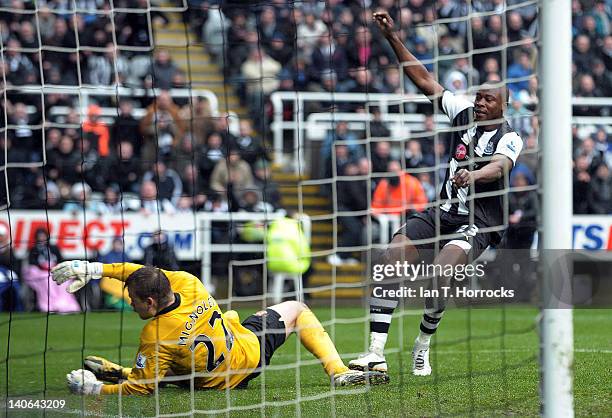 Shola Ameobi of Newcastle United scores the equalising goal past sunderland goalkeeper Simon Mignolet during the Barclays Premier League match...