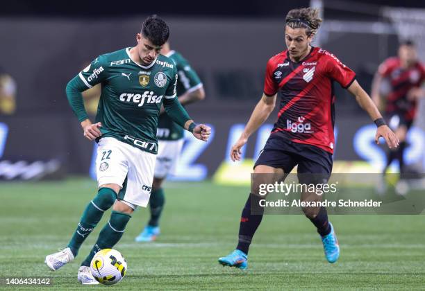 Piquerez of Palmeiras and Cannobio of Athletico Paranaense fight for the ball during a match between Palmeiras and Athletico Paranaense as part of...