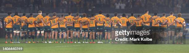 The Wallabies team stand together during the national anthem before game one of the international test match series between the Australian Wallabies...