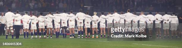 The England team stand together during the national anthem before game one of the international test match series between the Australian Wallabies...
