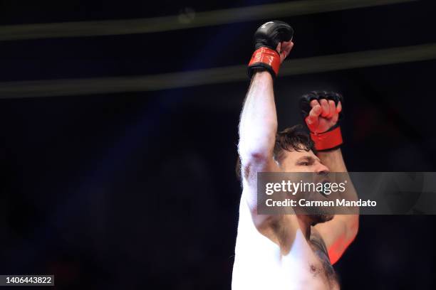 Jim Miller celebrates a second round submission over Donald Cerrone in their welterweight bout during UFC 276 at T-Mobile Arena on July 02, 2022 in...