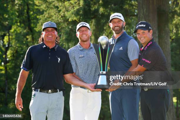 Team Captain Dustin Johnson , Pat Perez , Talor Gooch and Patrick Reed of 4 Aces GC celebrate with the team championship trophy during day three of...