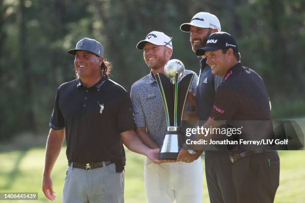 Team Captain Dustin Johnson , Pat Perez , Talor Gooch and Patrick Reed of 4 Aces GC celebrate with the team championship trophy during day three of...