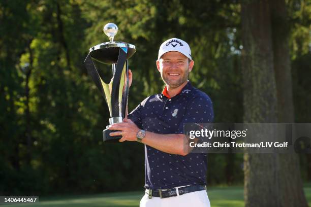 Branden Grace of Stinger GC poses with the trophy after winning first place individual during day three of the LIV Golf Invitational - Portland at...