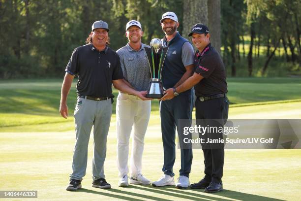 Team Captain Dustin Johnson , Pat Perez , Talor Gooch and Patrick Reed of 4 Aces GC celebrate with the team championship trophy during day three of...