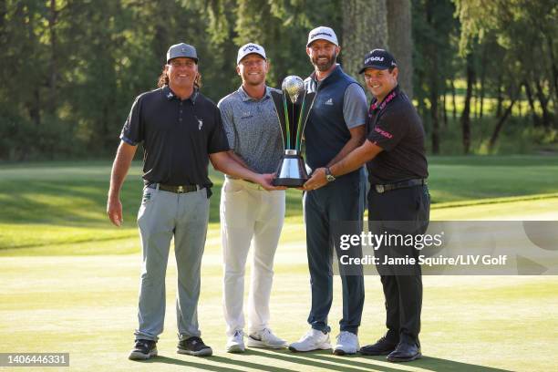 Team Captain Dustin Johnson , Pat Perez , Talor Gooch and Patrick Reed of 4 Aces GC celebrate with the team championship trophy during day three of...