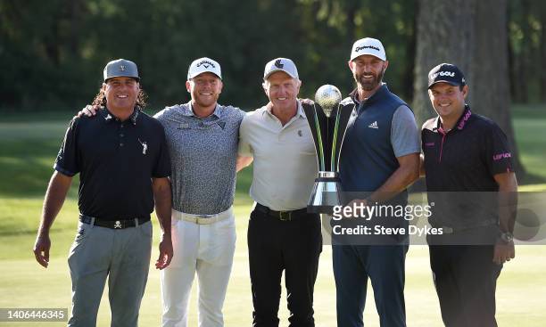Pat Perez, LIV Golf commissioner Greg Norman, Talor Gooch, Dustin Johnson, and Patrick Reed pose with the trophy after winning the team title at the...