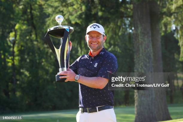 Branden Grace of Stinger GC poses with the trophy after winning first place individual during day three of the LIV Golf Invitational - Portland at...