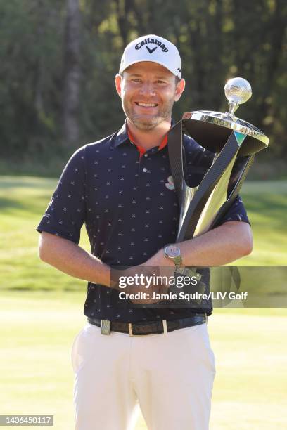 Branden Grace of Stinger GC poses with the trophy after winning first place individual during day three of the LIV Golf Invitational - Portland at...