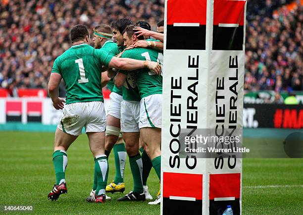 Tommy Bowe of Ireland is congratulated after scoring a try during the RBS Six Nations match between France and Ireland at Stade de France on March 4,...