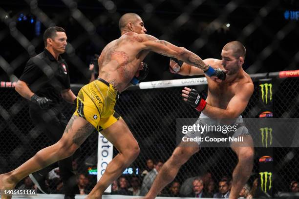 Alex Pereira of Brazil punches Sean Strickland during the UFC 276 event at T-Mobile Arena on July 02, 2022 in Las Vegas, Nevada.