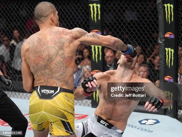 Alex Pereira of Brazil punches Sean Strickland during the UFC 276 event at T-Mobile Arena on July 02, 2022 in Las Vegas, Nevada.