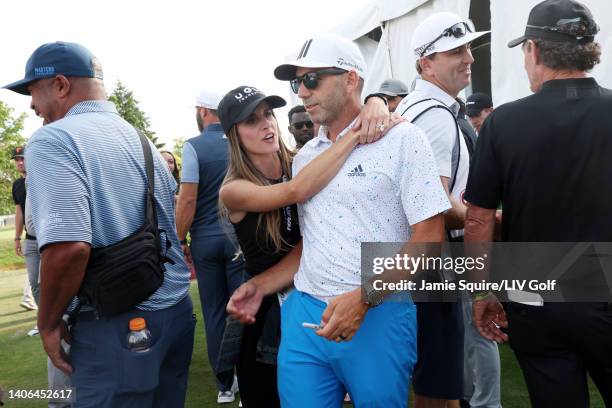 Team Captain Sergio Garcia of Fireballs GC and his wife Angela Akins Garcia stand near the 18th green during day three of the LIV Golf Invitational -...