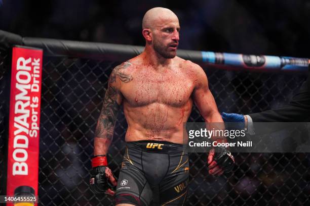 Alexander Volkanovski of Australia reacts to his win over Max Holloway in the UFC featherweight championship fight during the UFC 276 event at...