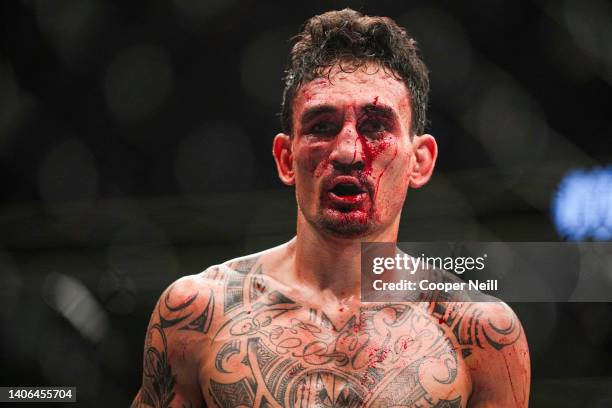 Max Holloway walks back to his corner during the UFC 276 event at T-Mobile Arena on July 02, 2022 in Las Vegas, Nevada.