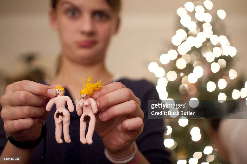 Girl holding Christmas ornaments