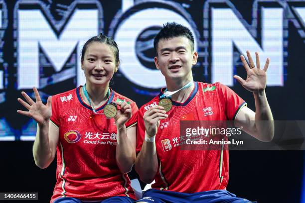 Zheng Si Wei and Huang Ya Qiong of China pose with their medals after winning the Mixed Doubles Finals match against Dechapol Puavaranukroh and...