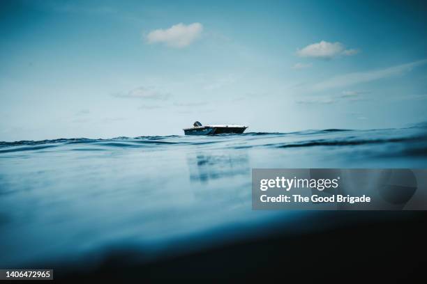 fishing boat on water against blue sky - indiska oceanen bildbanksfoton och bilder