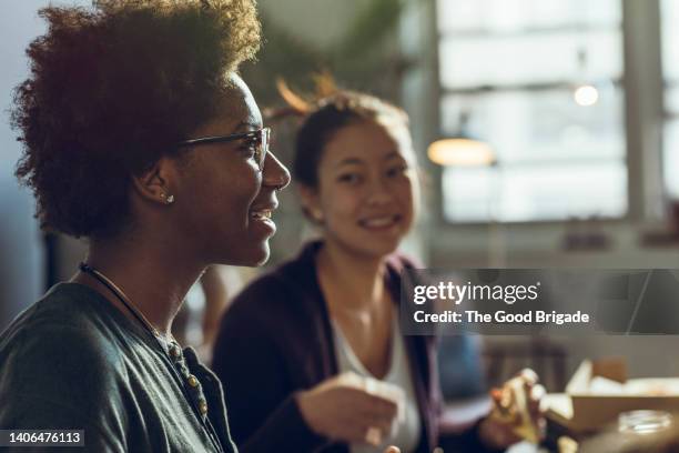 female friends spending leisure time while talking at home - roommate bildbanksfoton och bilder