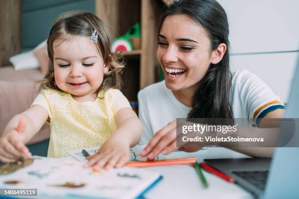 mother and daughter working at home. - freelance child stock pictures, royalty-free photos & images