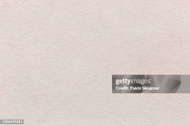 light grayish orange color eco recycled kraft paper sheet texture cardboard background. - beige suit stock pictures, royalty-free photos & images