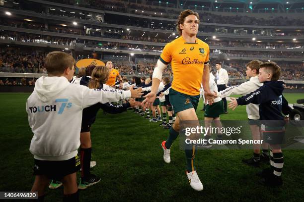 Michael Hooper of the Wallabies leads team mates onto the field during game one of the international test match series between the Australian...