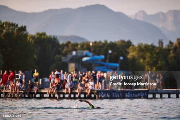 Athletes compete in the swim section during the IRONMAN Austria on July 03, 2022 in Klagenfurt, Austria.