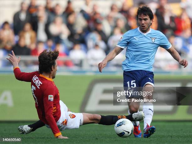 Gabriel Heinze of AS Roma competes for the ball with Alvaro Gonzalez of SS Lazio during the Serie A match between AS Roma and SS Lazio at Stadio...