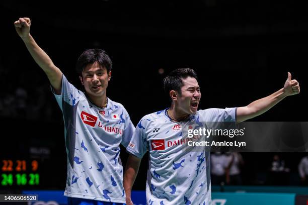 Yugo Kobayashi and Takuro Hoki of Japan celebrate the victory after winning the Men's Doubles Finals match against Muhammad Rian Ardianto and Fajar...