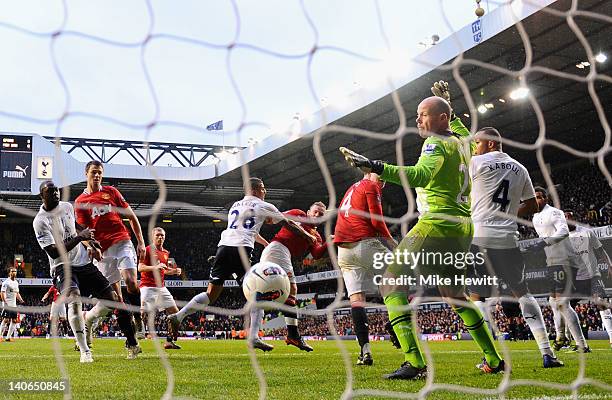 Wayne Rooney of Manchester United scores a headed goal from a corner past Brad Friedel of Tottenham Hotspur during the Barclays Premier League match...