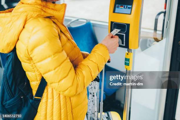 tourist validating ticket in bus - validation stock pictures, royalty-free photos & images