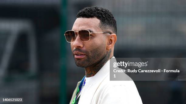 Jermaine Pennant looks on in the pitlane prior to the F1 Grand Prix of Great Britain at Silverstone on July 03, 2022 in Northampton, England.