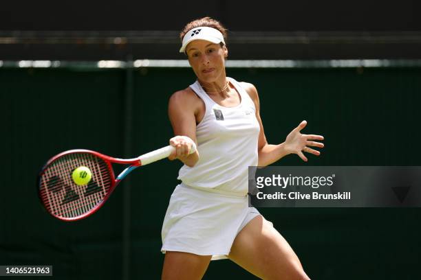 Tatjana Maria of Germany plays a forehand against Jelena Ostapenko of Latvia during their Women's Singles Fourth Round match on day seven of The...