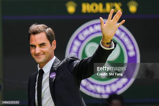Roger Federer of Switzerland greets the audience during the Centre Court Centenary Celebration during day seven of The Championships Wimbledon 2022...
