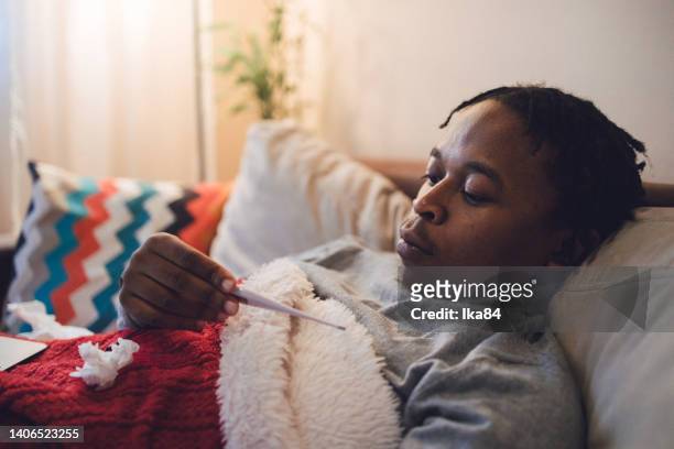 young ill african-american man having interaction with doctor over laptop - consultation lake stock pictures, royalty-free photos & images