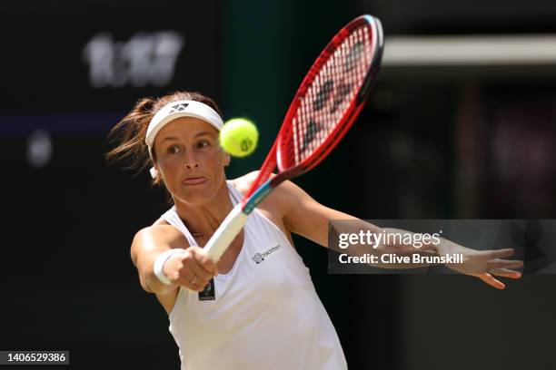 Tatjana Maria of Germany plays a backhand against Jelena Ostapenko of Latvia during their Women's Singles Fourth Round match on day seven of The...