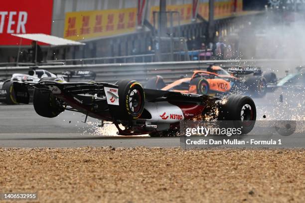 Zhou Guanyu of China driving the Alfa Romeo F1 C42 Ferrari crashes at the start during the F1 Grand Prix of Great Britain at Silverstone on July 03,...