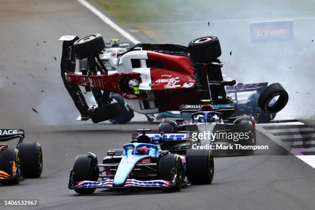 Zhou Guanyu of China driving the Alfa Romeo F1 C42 Ferrari crashes at the start during the F1 Grand Prix of Great Britain at Silverstone on July 03,...